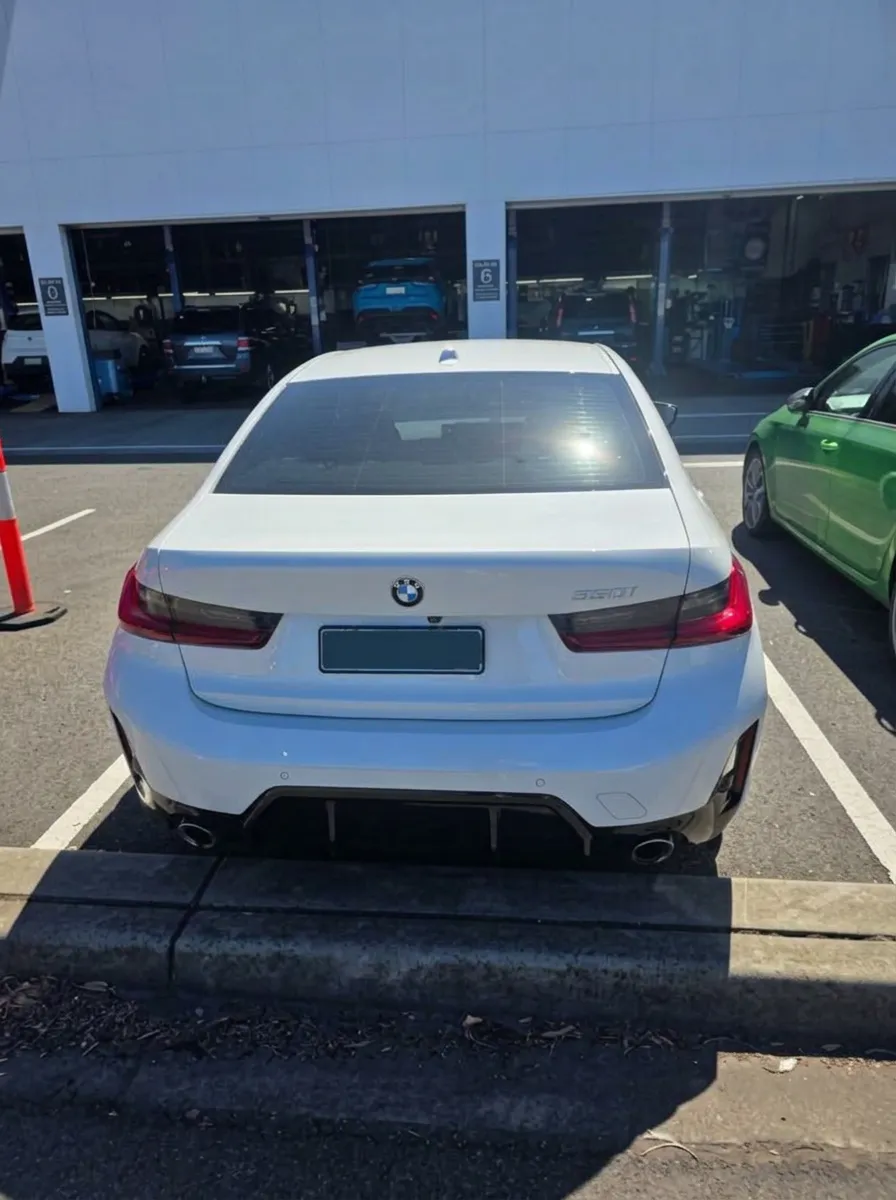White BMW sedan financed by JLP Financial for personal use