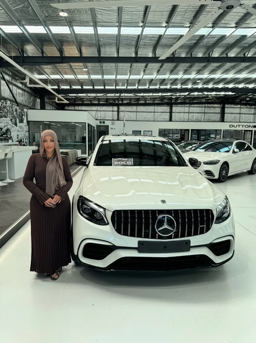 Happy client at Mercedes-Benz dealership with car financed by JLP Financial